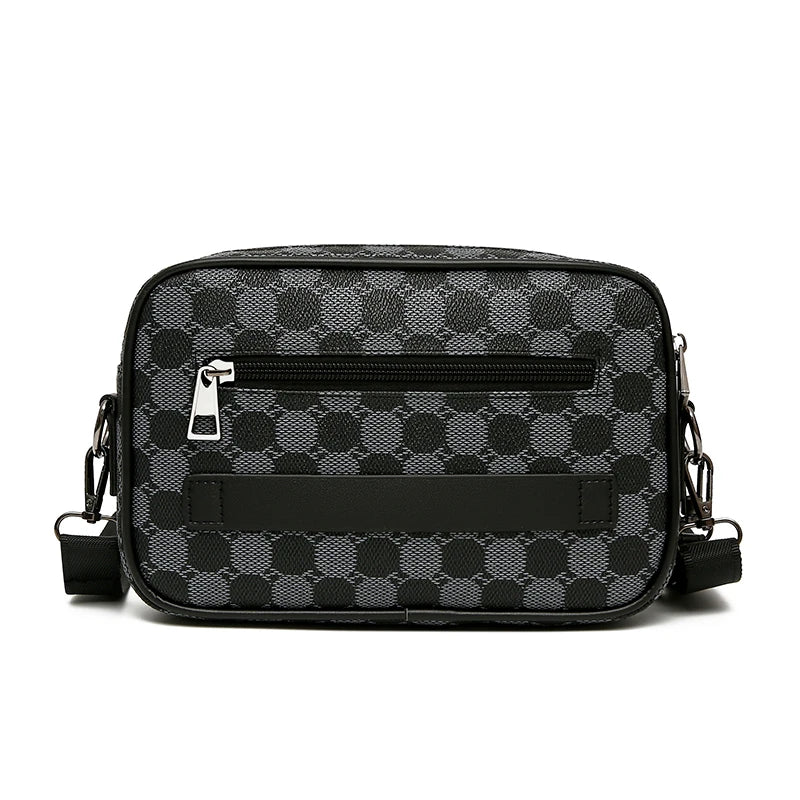 Black patterned leather toilet bag on a white background