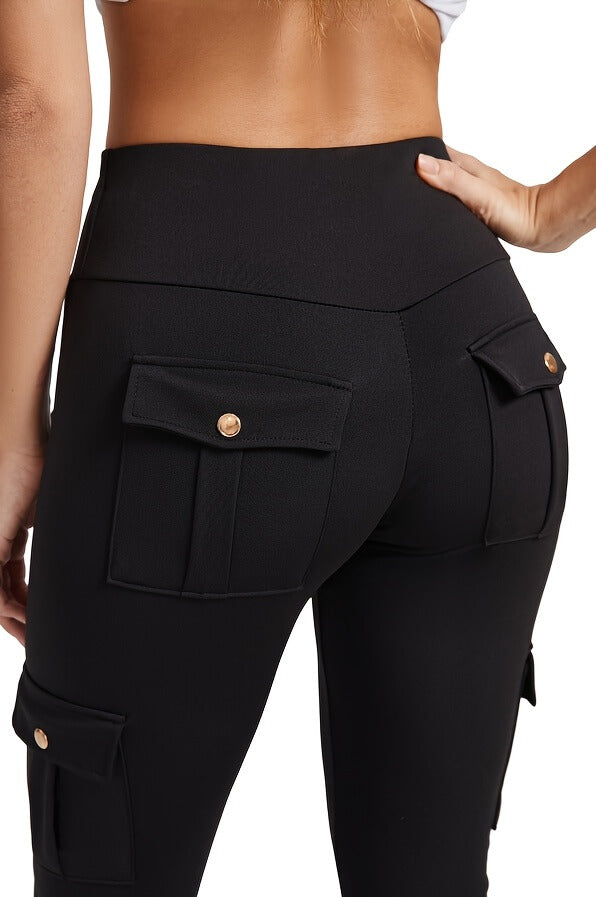 The back view of a woman wearing a pair of black yoga legging sold by 100 Spartans