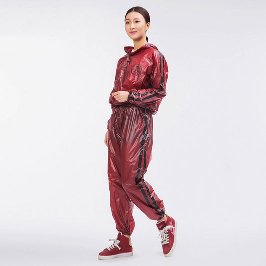 Person wearing a red shiny tracksuit on a white background