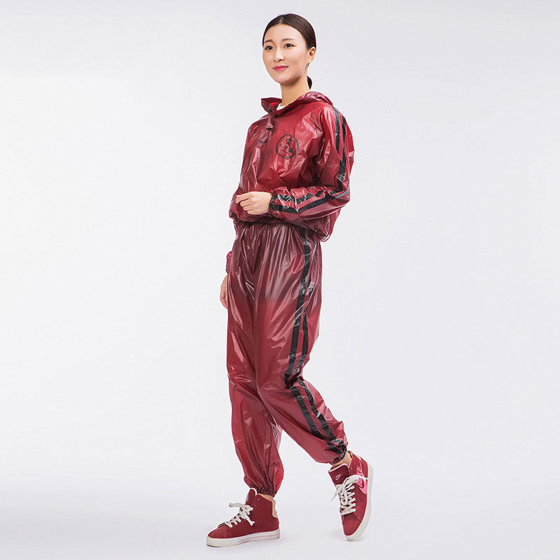 Person wearing a red shiny tracksuit on a white background
