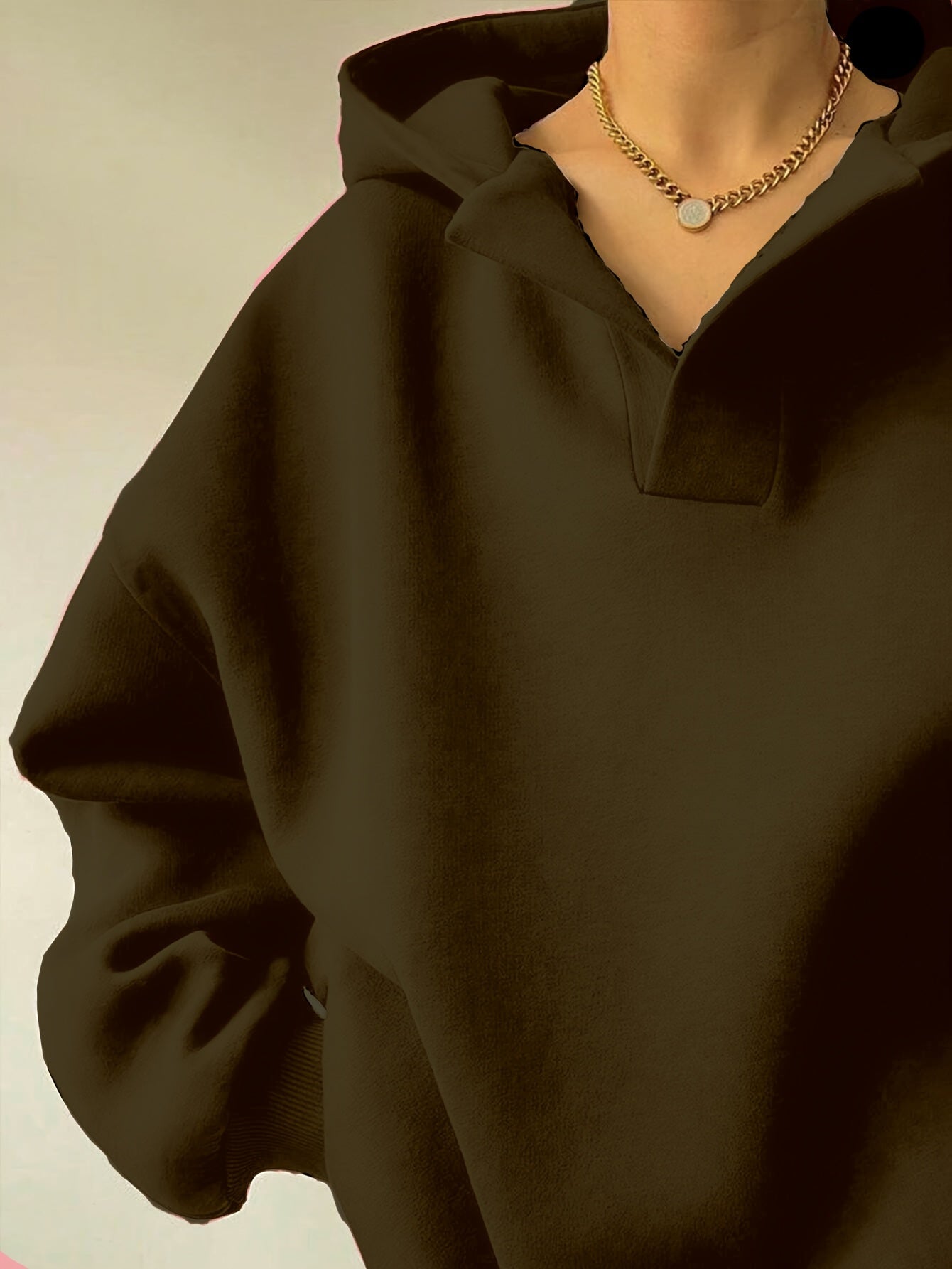 The front view of a woman wearing a camouflage winter hoodie for women sold by 100 Spartans