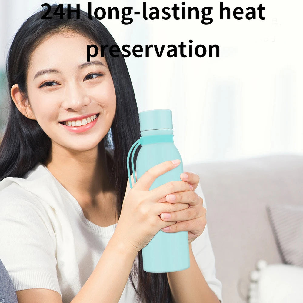 A woman holding a smart water bottle sold by 100 Spartans