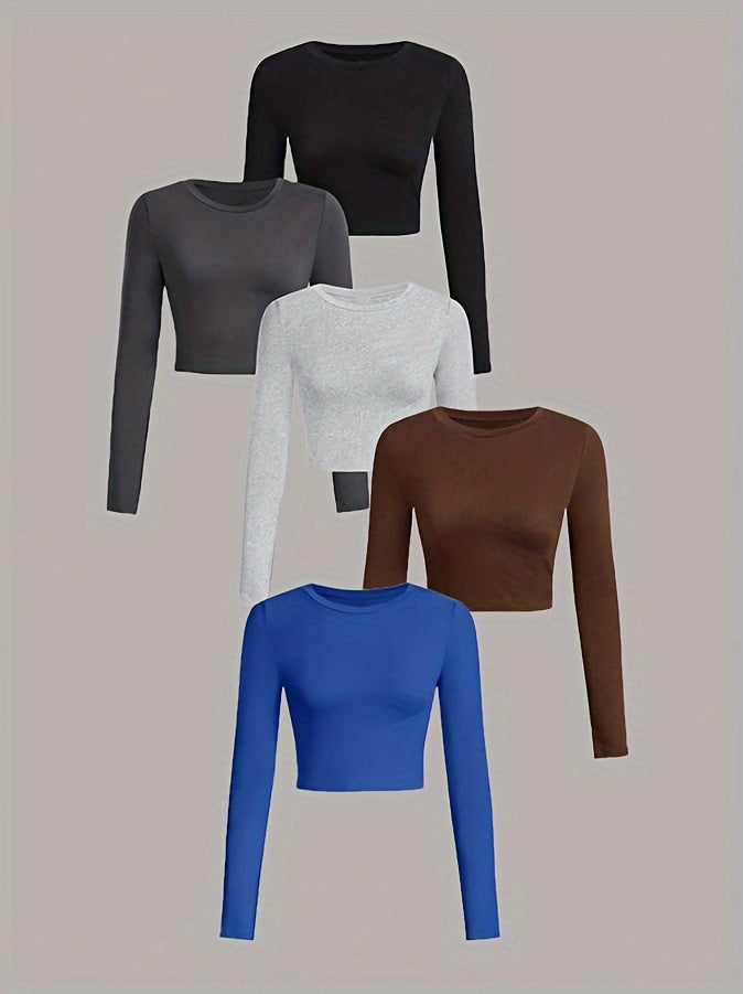 Five long-sleeve crop tops in black, gray, white, brown, and blue on a beige background.