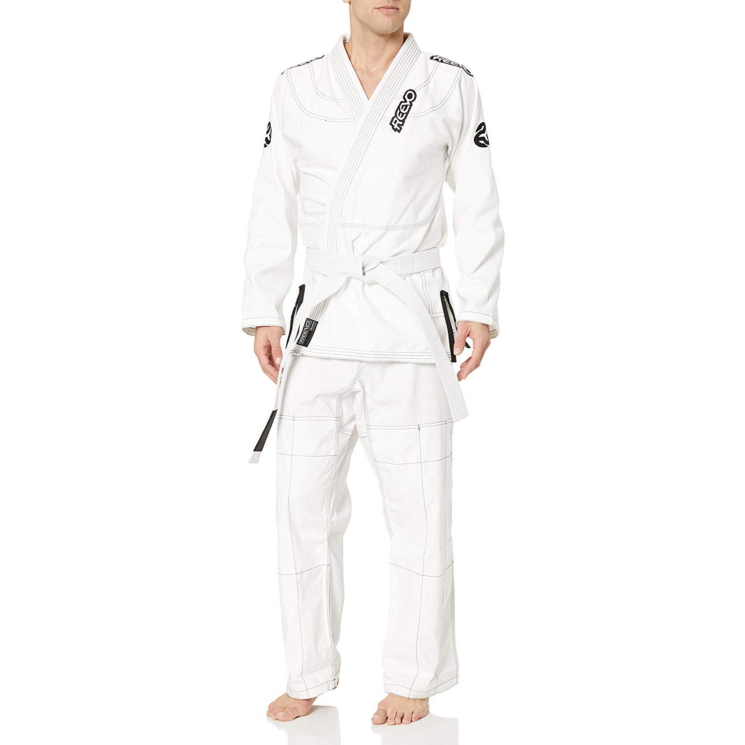 Person wearing a white BJJ Gi Reevo branding on a white background