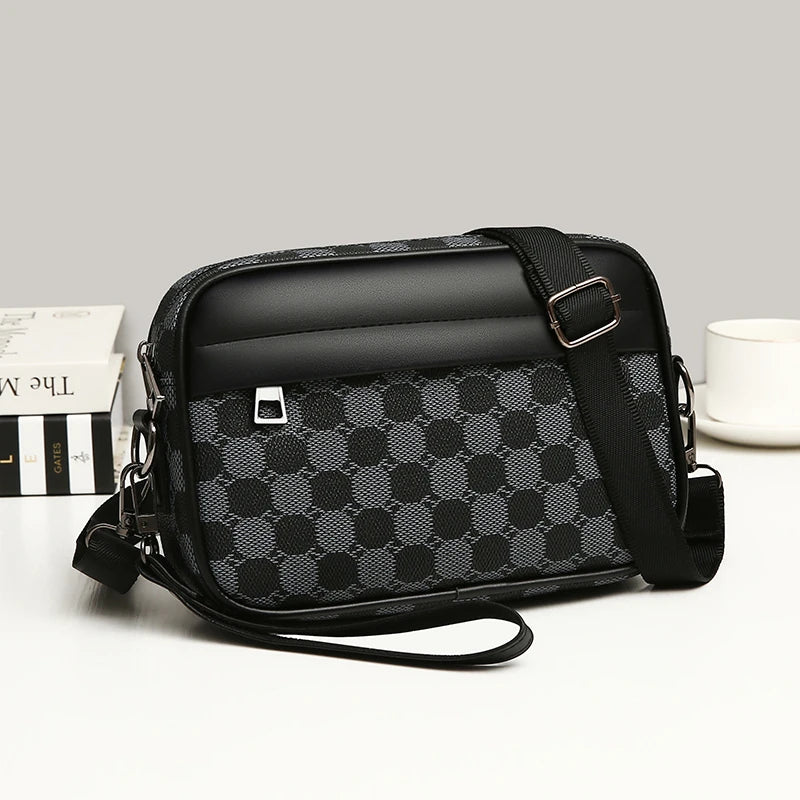 Black and gray patterned leather toiletry bag on a light gray background