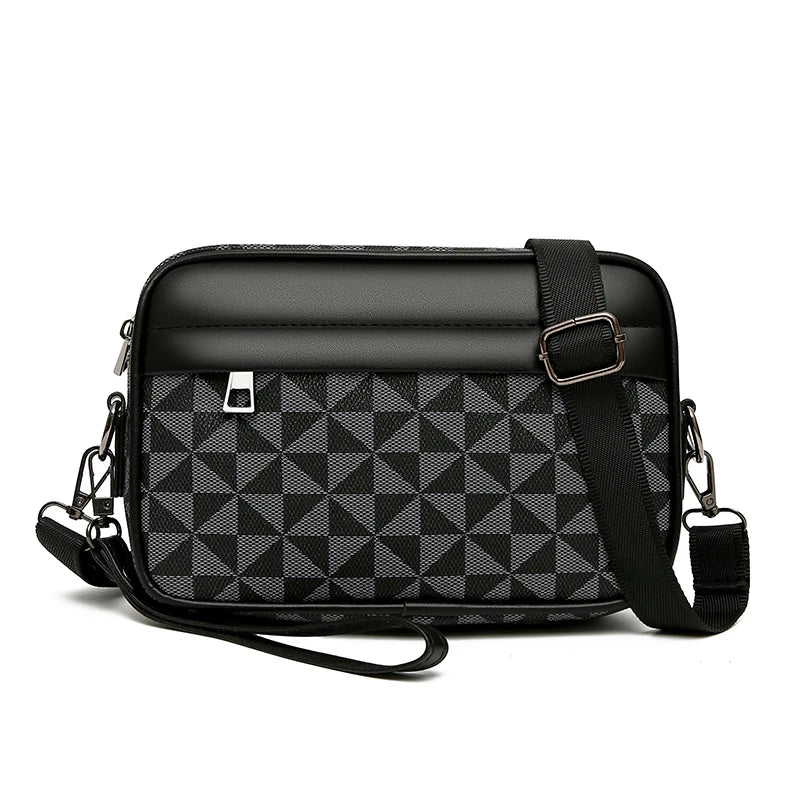 Black geometric patterned leather toiletry bag with a strap on a white background