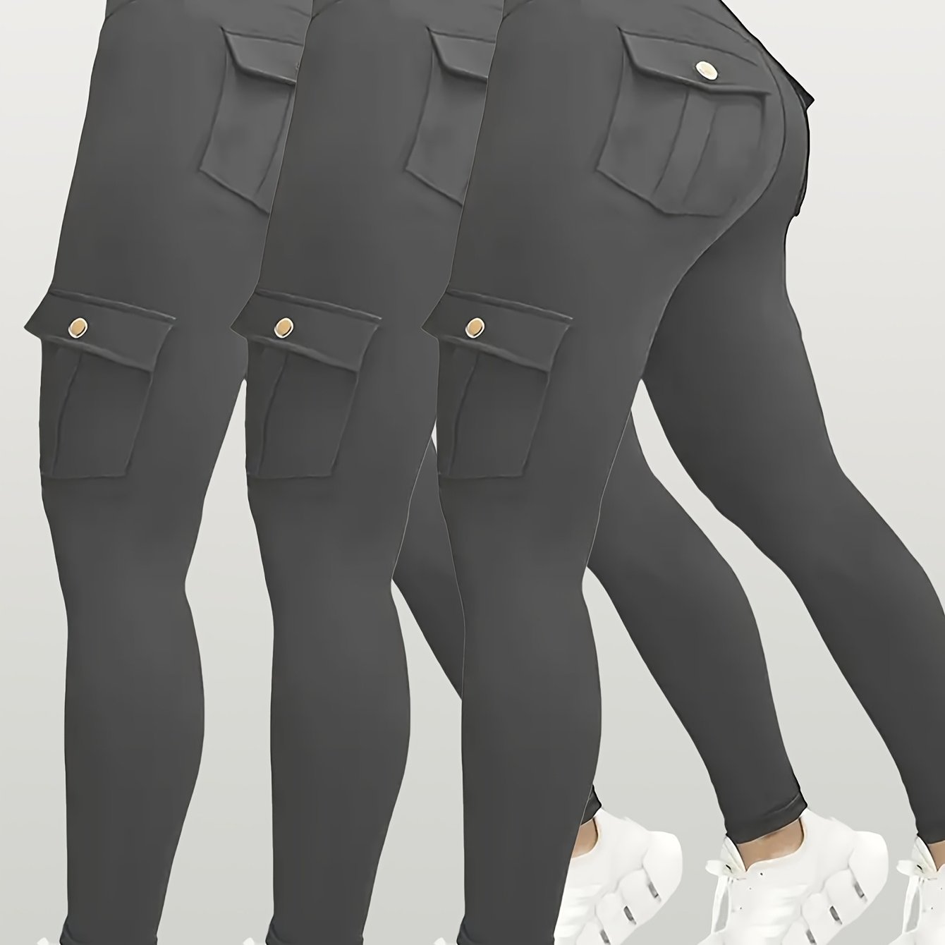 Black yoga leggings with pocket details on a light gray background