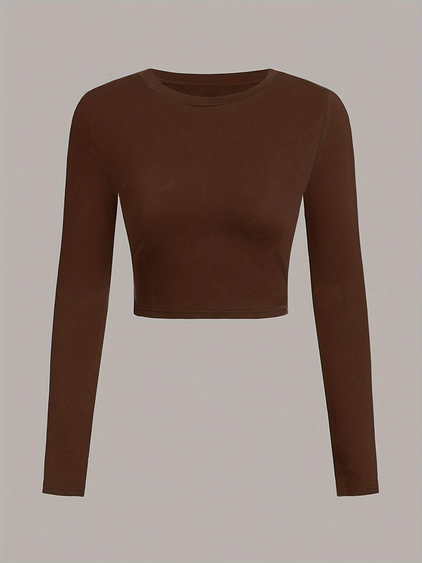 Brown long-sleeve crop top on a light gray background