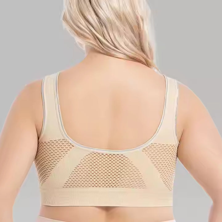 The back of a plus size woman wearing a beige plus size sports bra for running sold by 100 Spartans