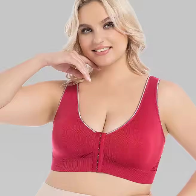 A plus size woman wearing a red plus size sports bra for running sold by 100 Spartans
