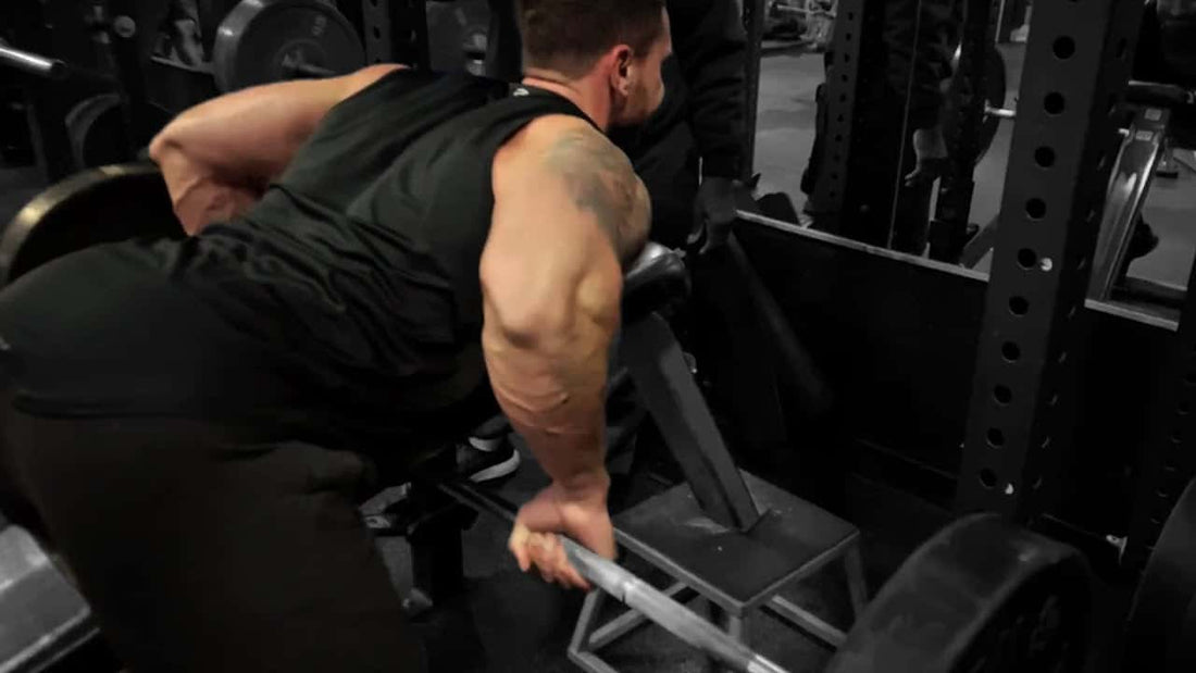 A man doing a chest support row for bigger back