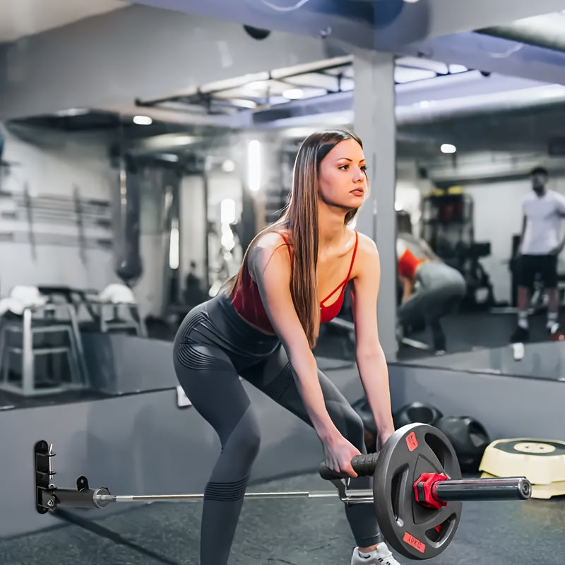 Woman lifting weights with a T bar row handle in a gym setting