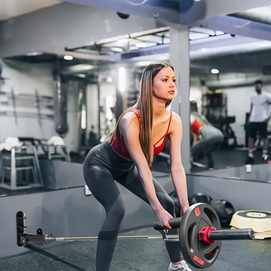 Woman lifting weights with a T bar row handle in a gym setting