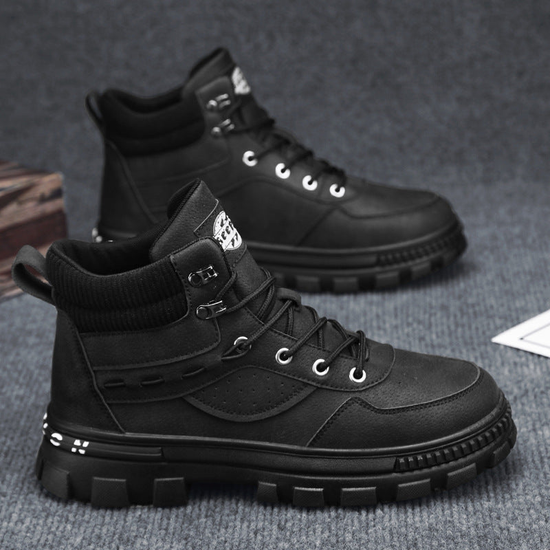 A pair of black Martin high top boots
