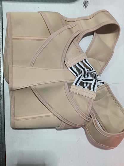 A beige structured support belt or waist trainer with multiple straps and a black-and-white patterned fabric accent, laid flat on a light gray surface.