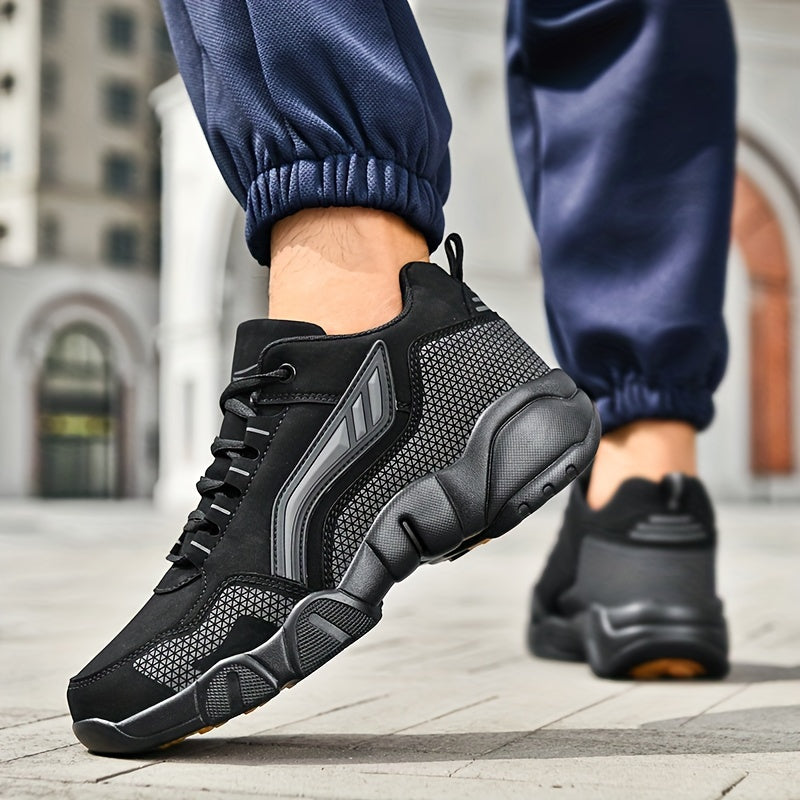 Black athletic shoes worn on a city street with blurred background