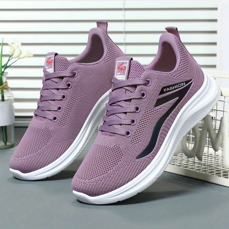 Purple running shoes with white soles on a neutral background
