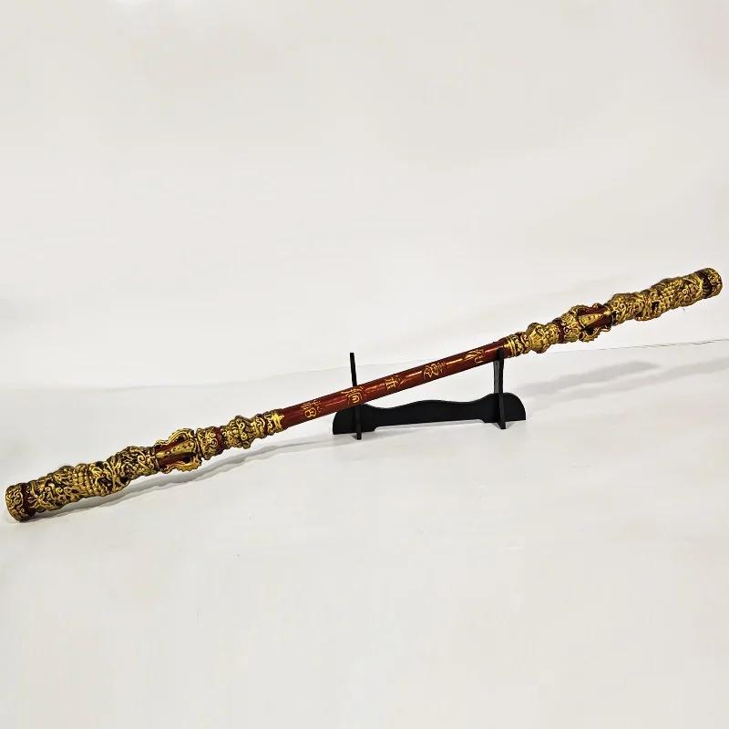 A Sun Wukong Stick with gold embellishments on a white background