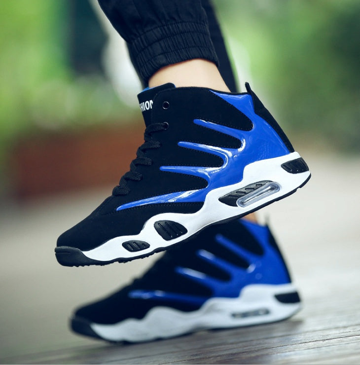 Black and blue high-top sneakers with white soles on a blurred background
