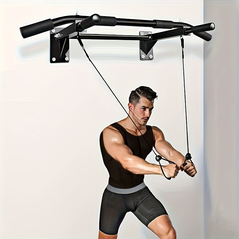 Man using a wall mount pull up bar against a white wall