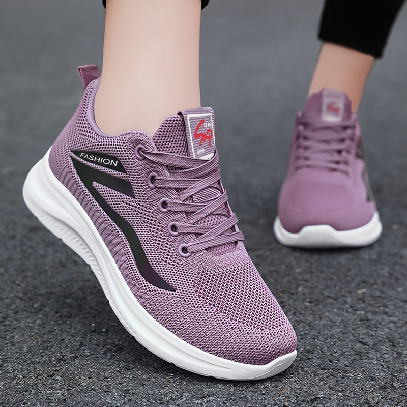 Purple running shoes with white soles on a dark surface