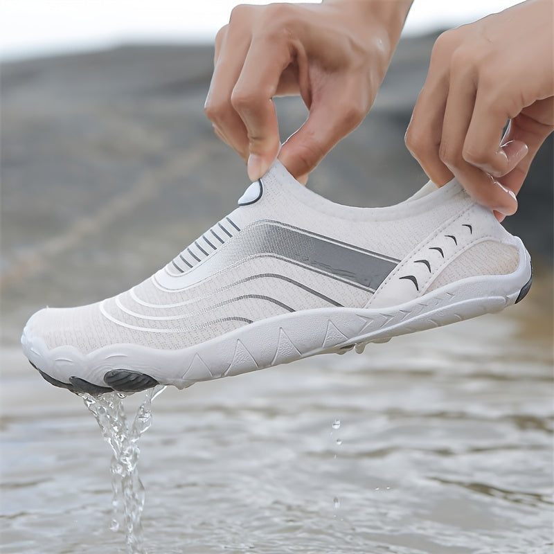 White water hiking shoes being worn with water dripping from them, set against a natural background.