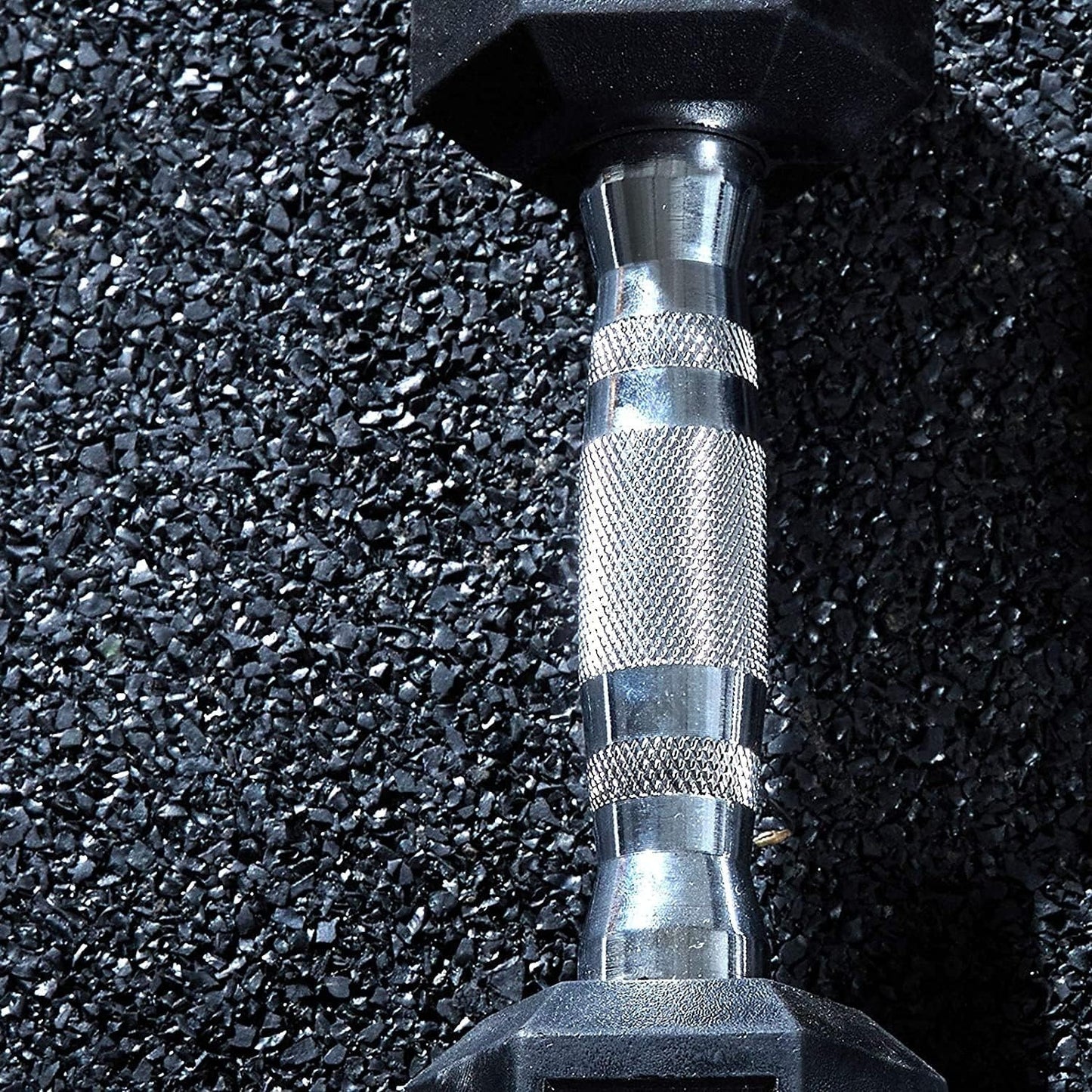 Hex dumbbell on a textured black surface