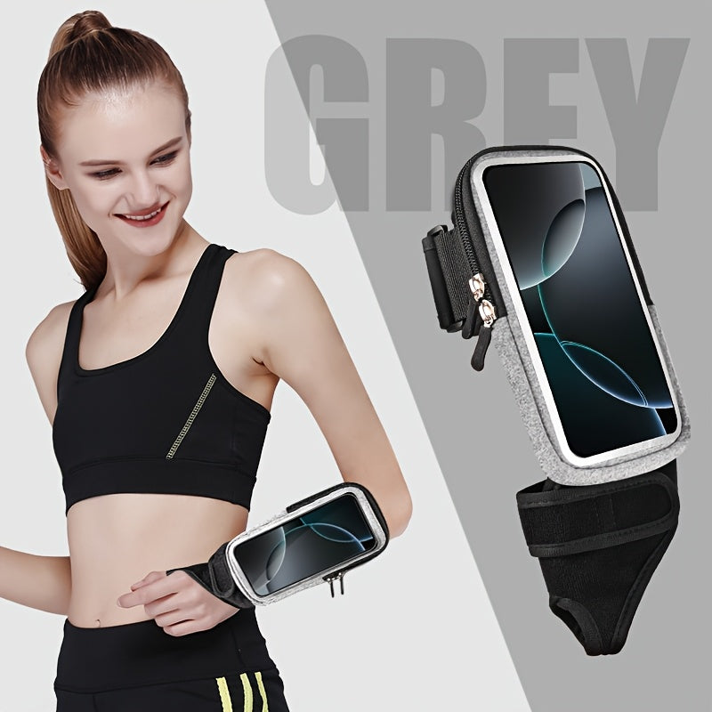 Woman wearing a black sports bra and leggings with a phone holder for running, on a light gray background.