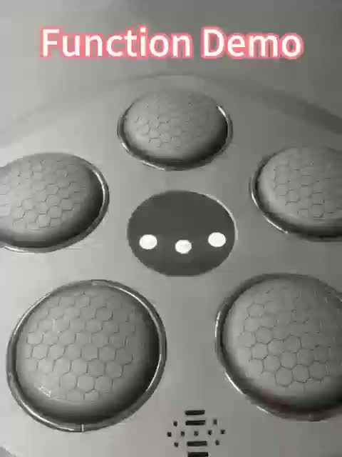 Metallic surface of a boxing music machine with circular components labeled 'Function Demo'.