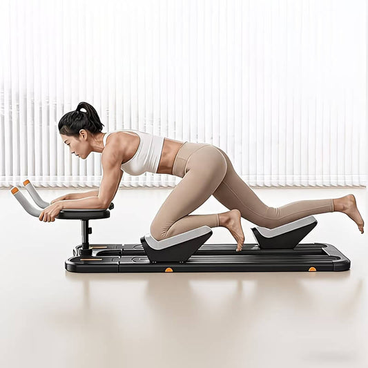 A woman working out with a crawl & spine twist and stretch trainer