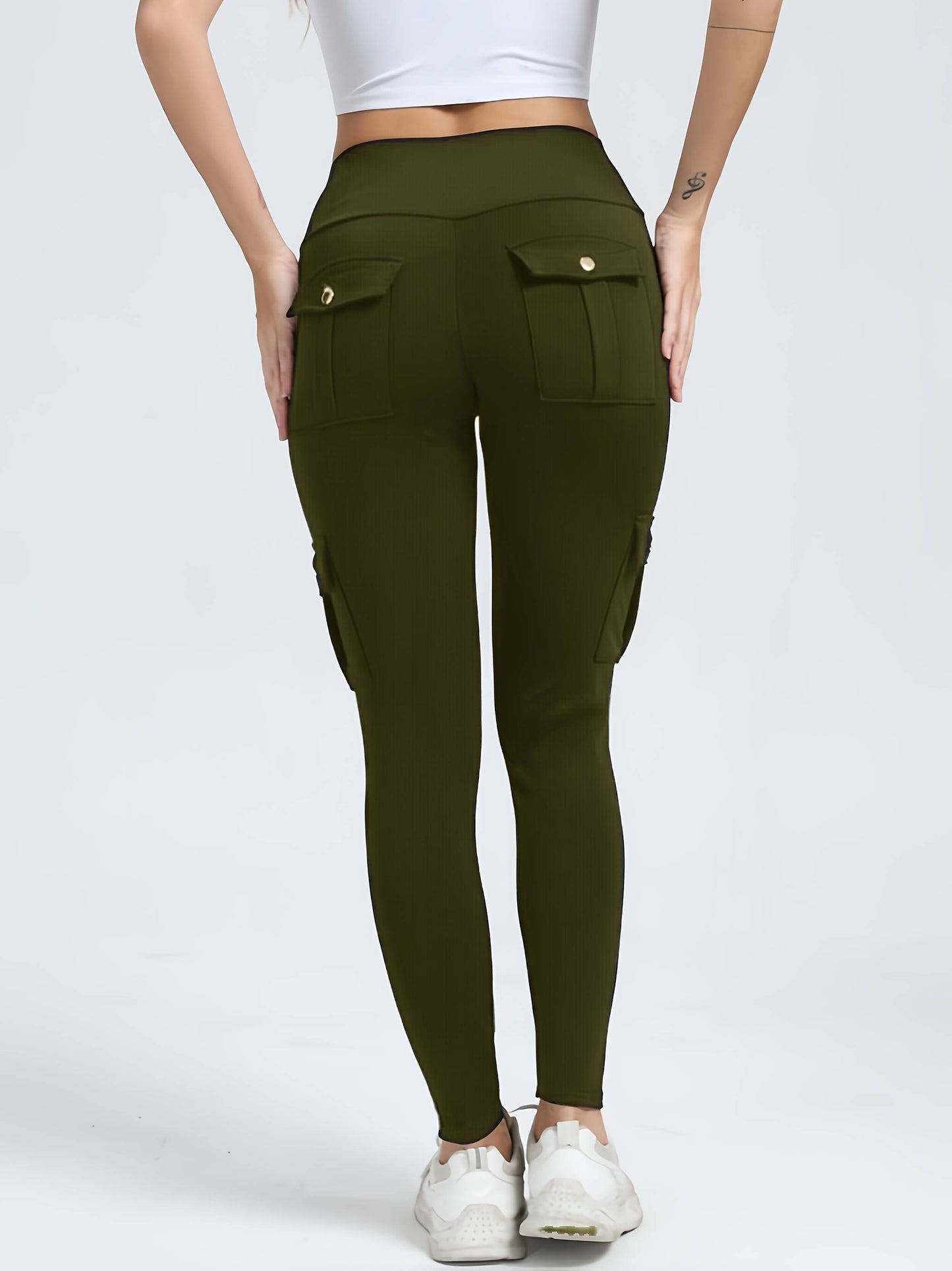 The back view of a woman wearing a pair of camouflage yoga legging sold by 100 Spartans