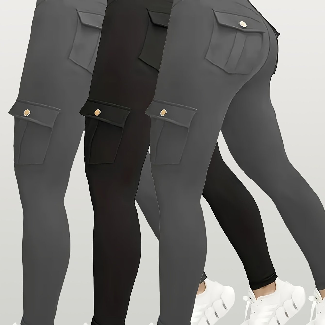 Black yoga leggings with pocket details on a light gray background