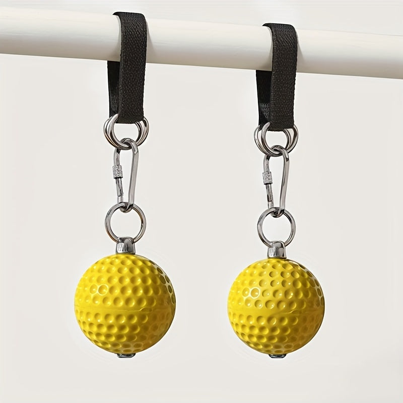 Two yellow pull up grip balls​ with black straps hanging from a white bar.