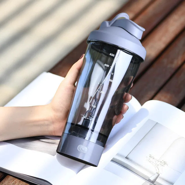 A gray blender water bottle sold by 100 Spartans