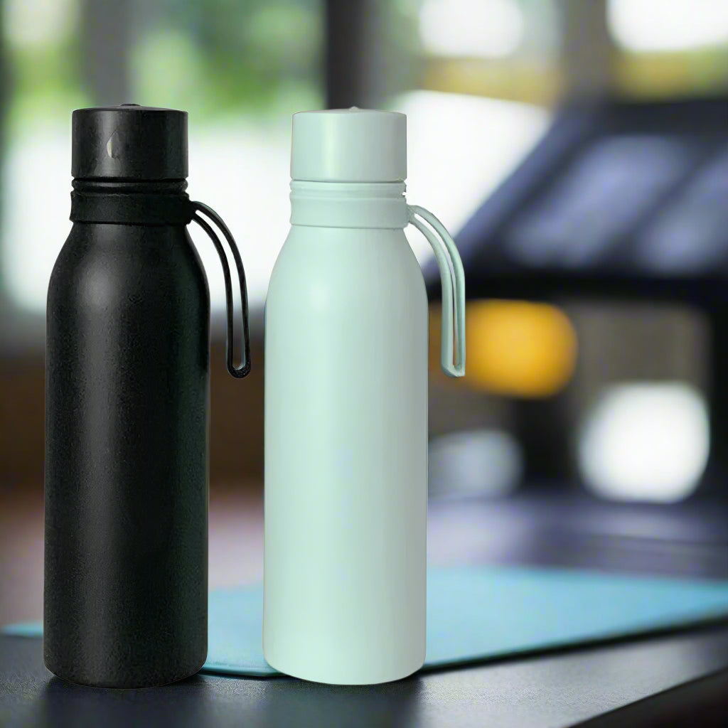 2 smart water bottles sold by 100 Spartans placed on a flat surface