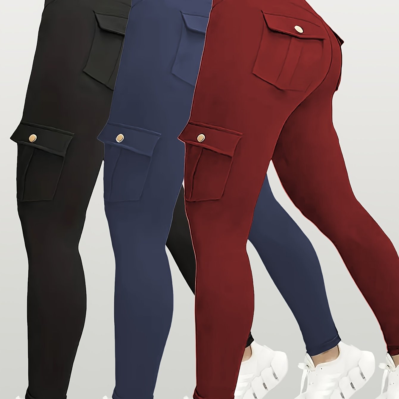 Three pairs of yoga leggings in black, blue, and red on a white background