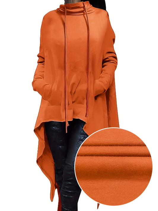 A woman wearing an orange women’s oversized hoodie sold by 100 Spartans