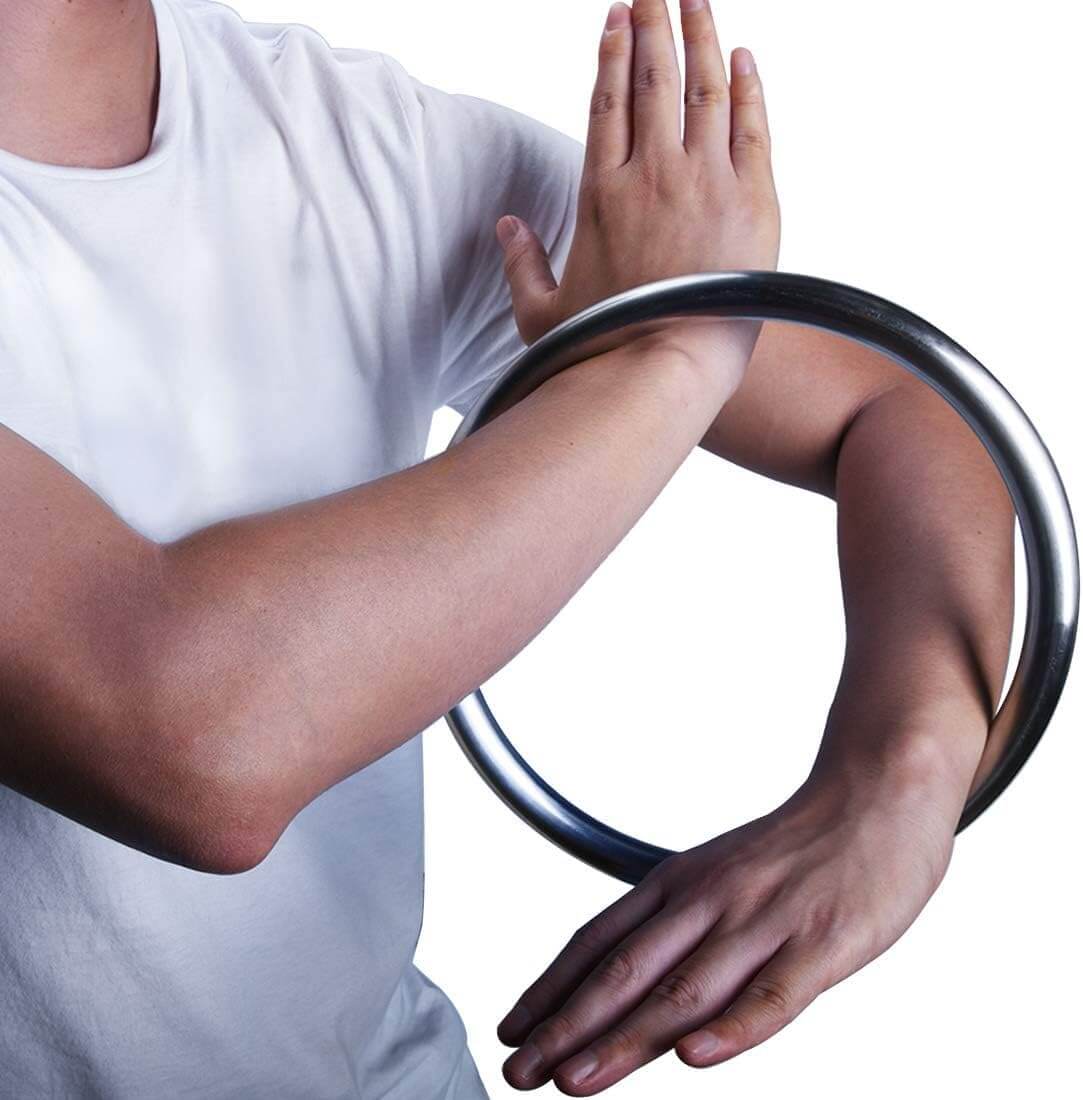 A person wearing a white t-shirt and training with a wing chun ring with a plain background