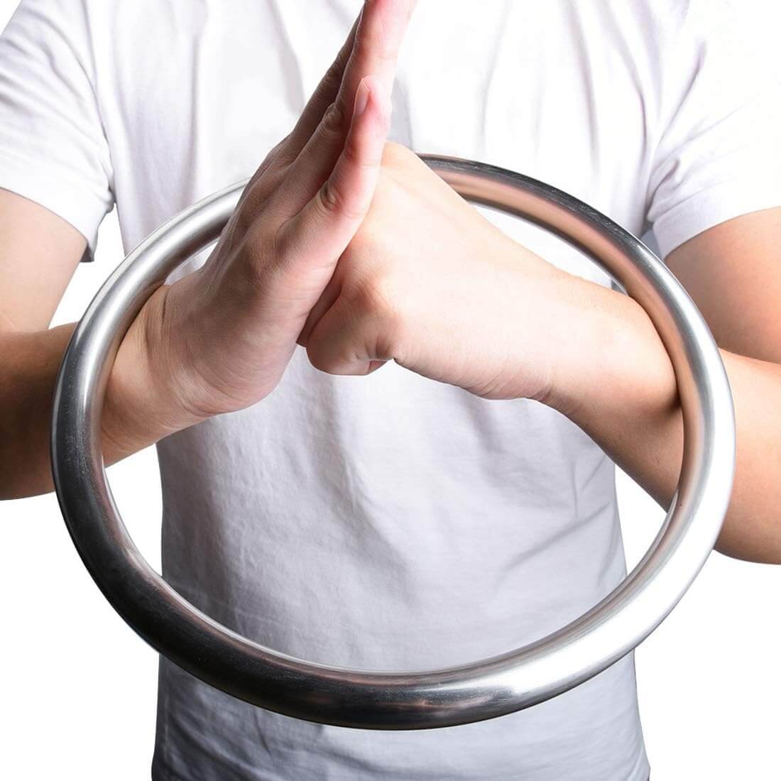 A person training with a wing chun ring with a plain background