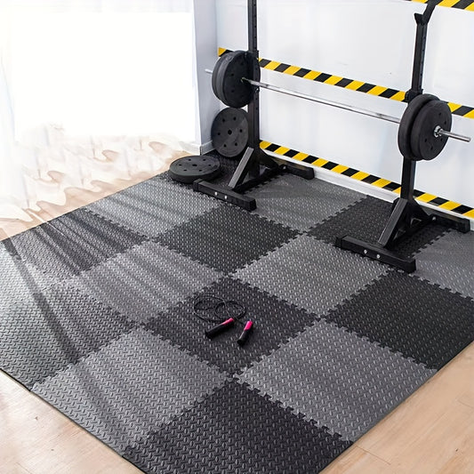 Gym setup with weightlifting equipment on a checkered foam mat