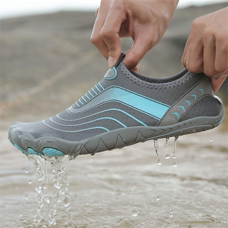 Gray and blue water hiking shoes being held above water
