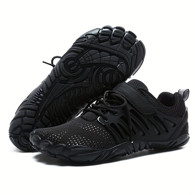 Pair of black barefoot hiking shoes on a white background