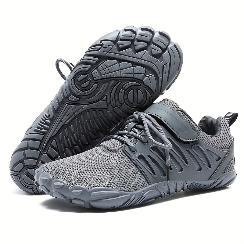 Gray barefoot hiking shoes with textured soles on a white background