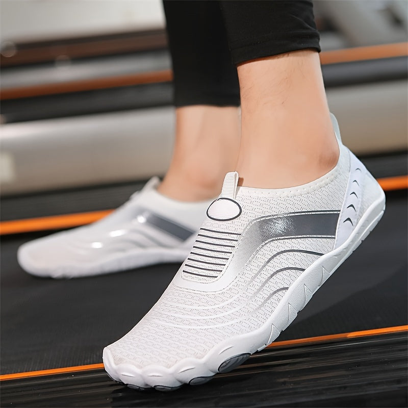 White slip-on water hiking shoes with black accents worn by a person on a blurred background