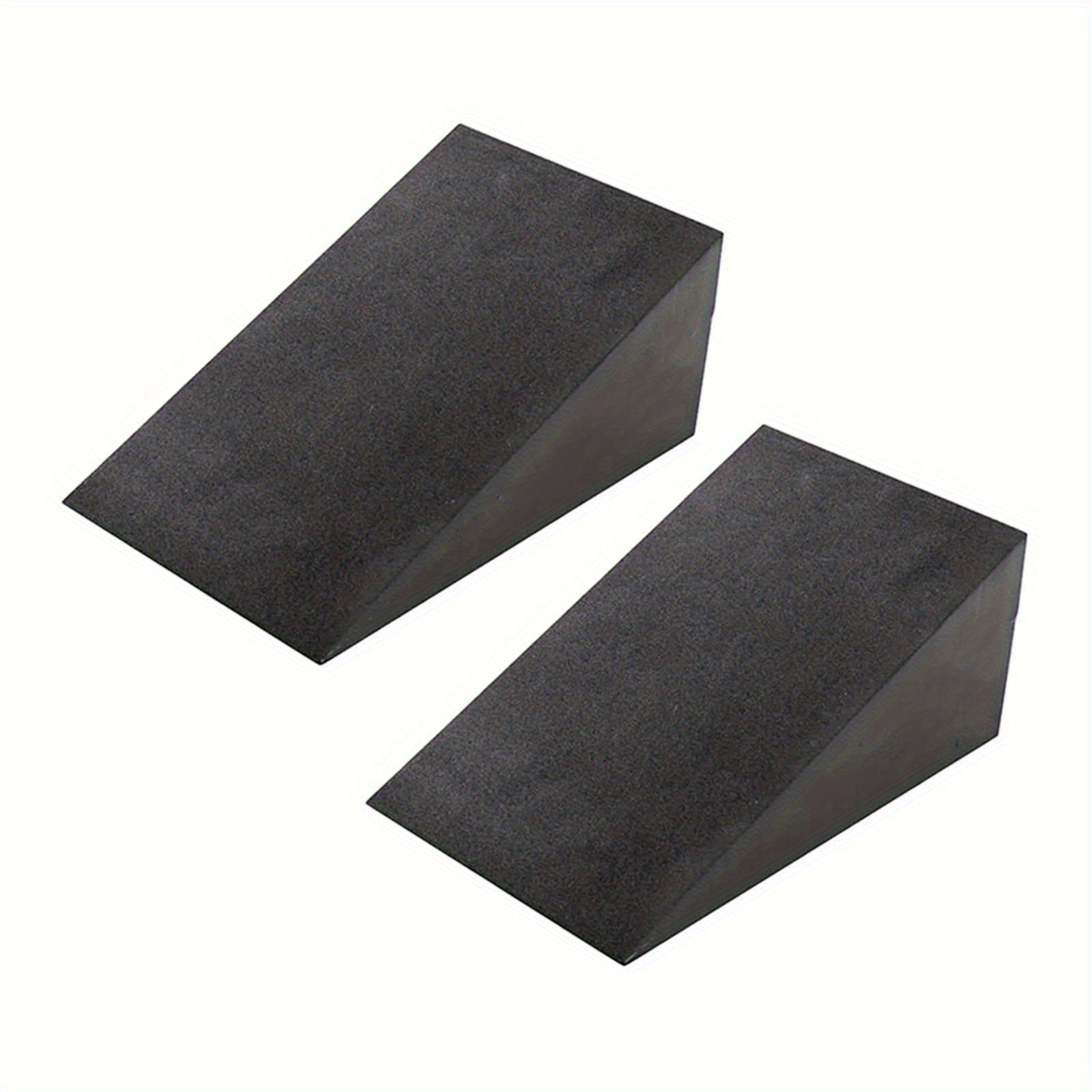 Two black squat wedge blocks on a white background