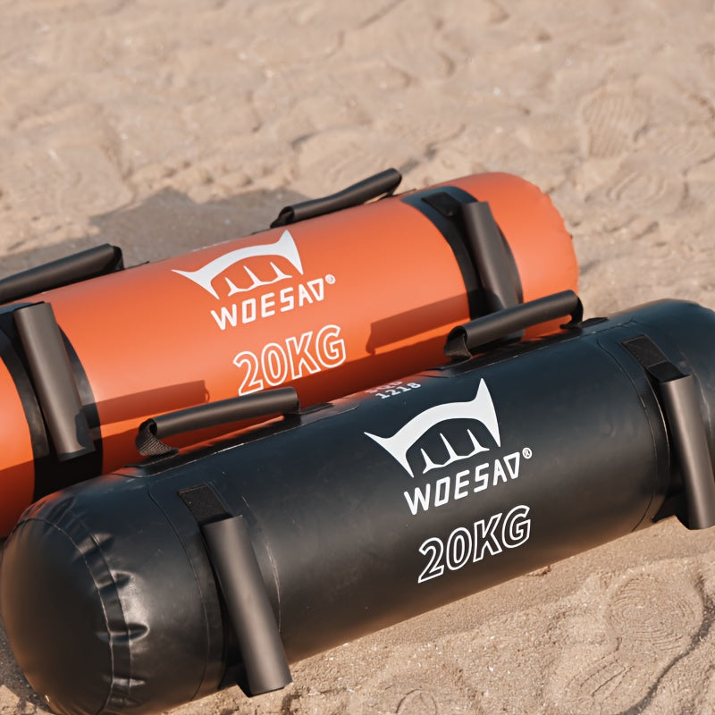 Water weight bags​ one orange and one black, each labeled with '20KG' on a concrete surface.