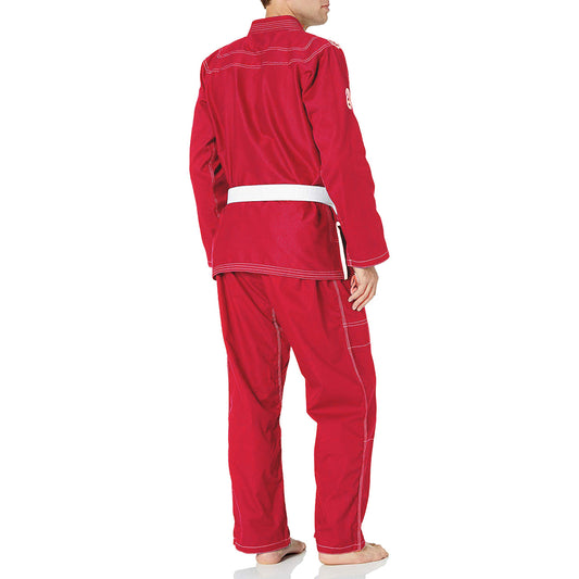 Person wearing a red bjj gi on a white background