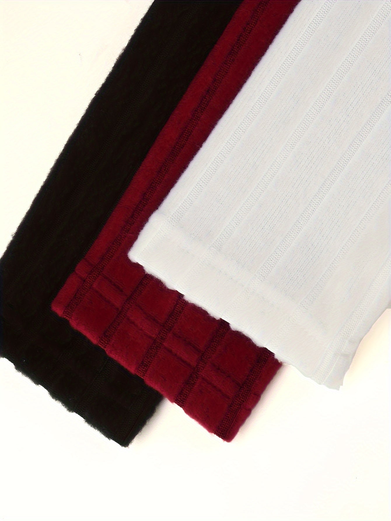 Close-up of black, red, and white fabric on a white background