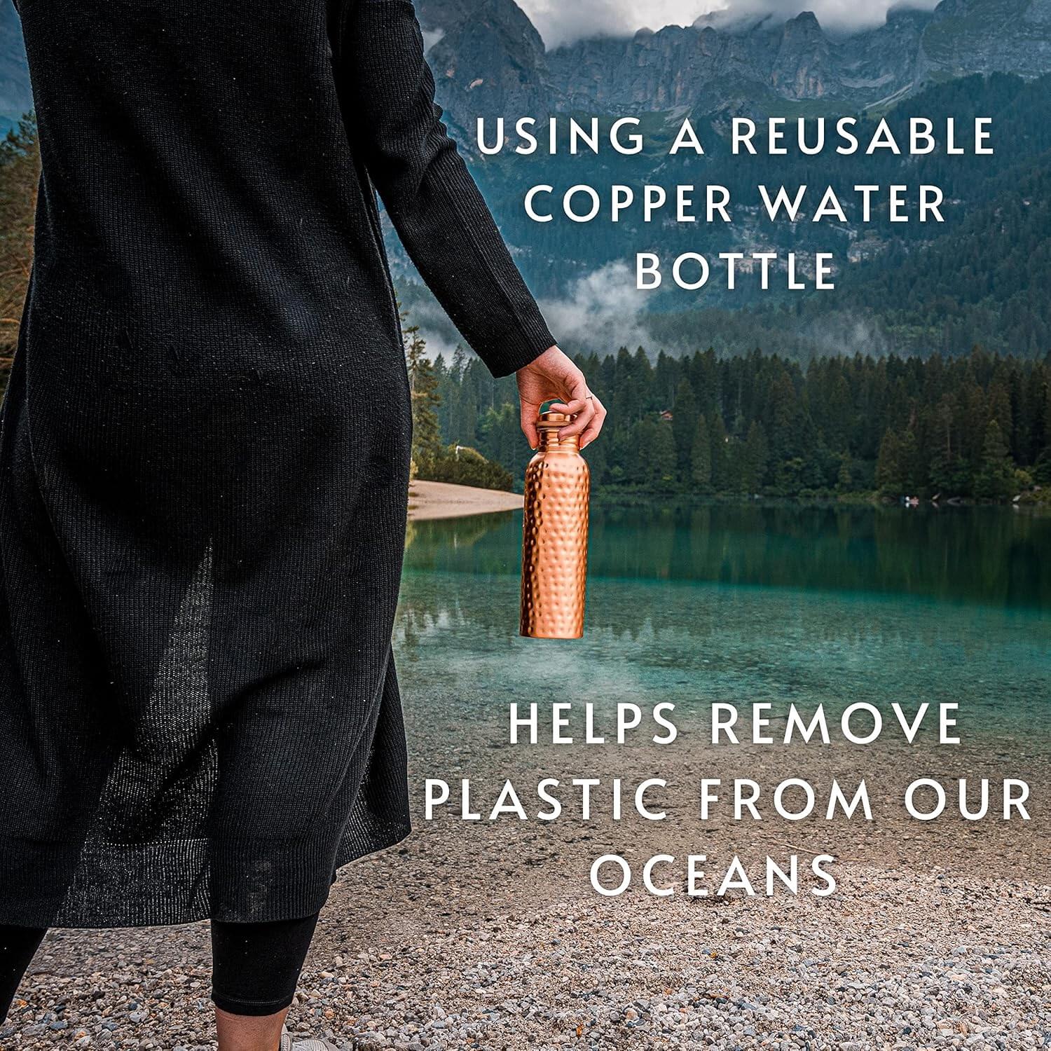 Person holding a reusable copper water bottle with scenic background and text about ocean plastic reduction.