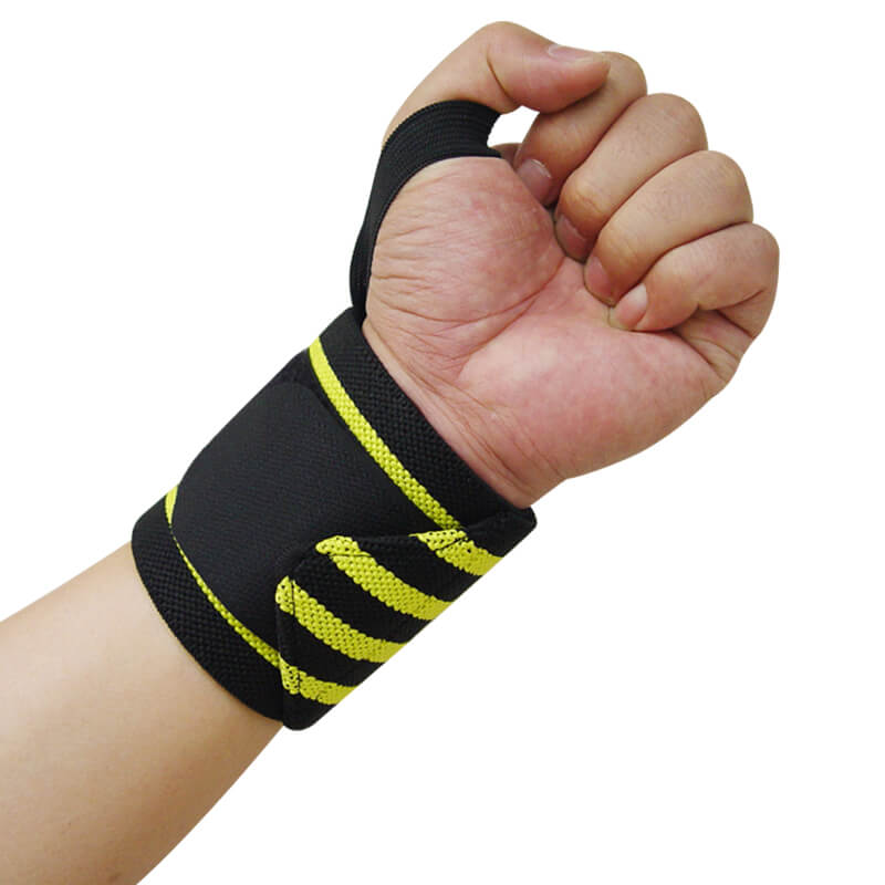 Hand wearing a black wrist wrap with yellow stripes on a white background
